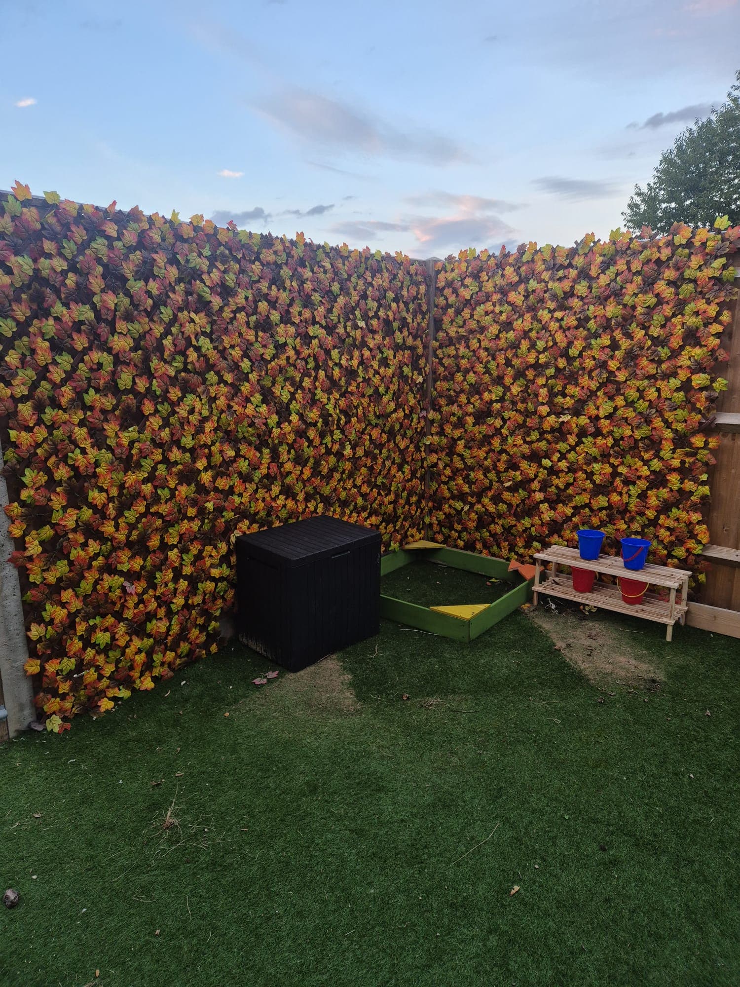 A garden sensory and water-play corner at Daisy Rose Daycare, Caversham.