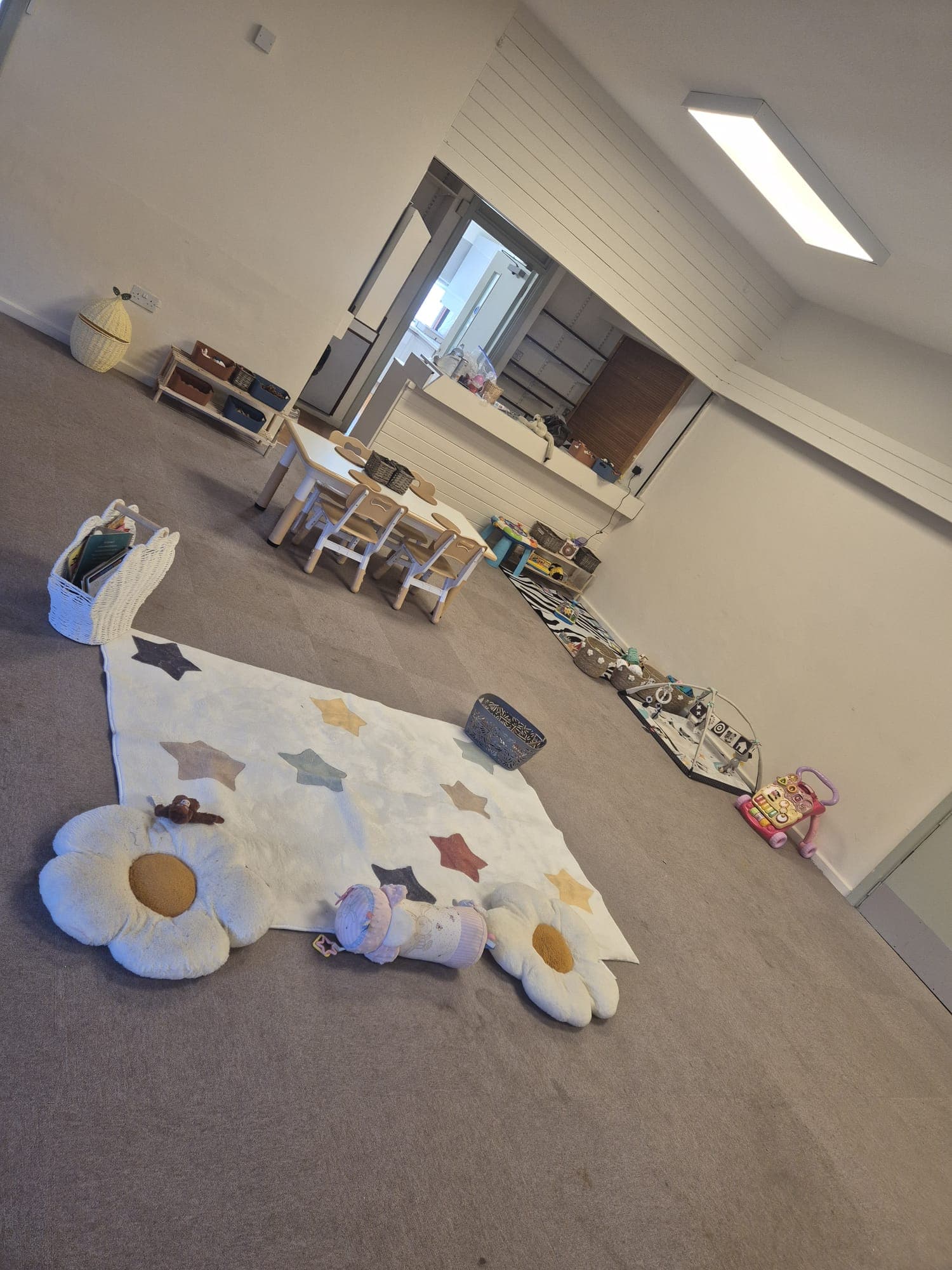 A welcoming, homely corner of the main play room at Daisy Rose Daycare.