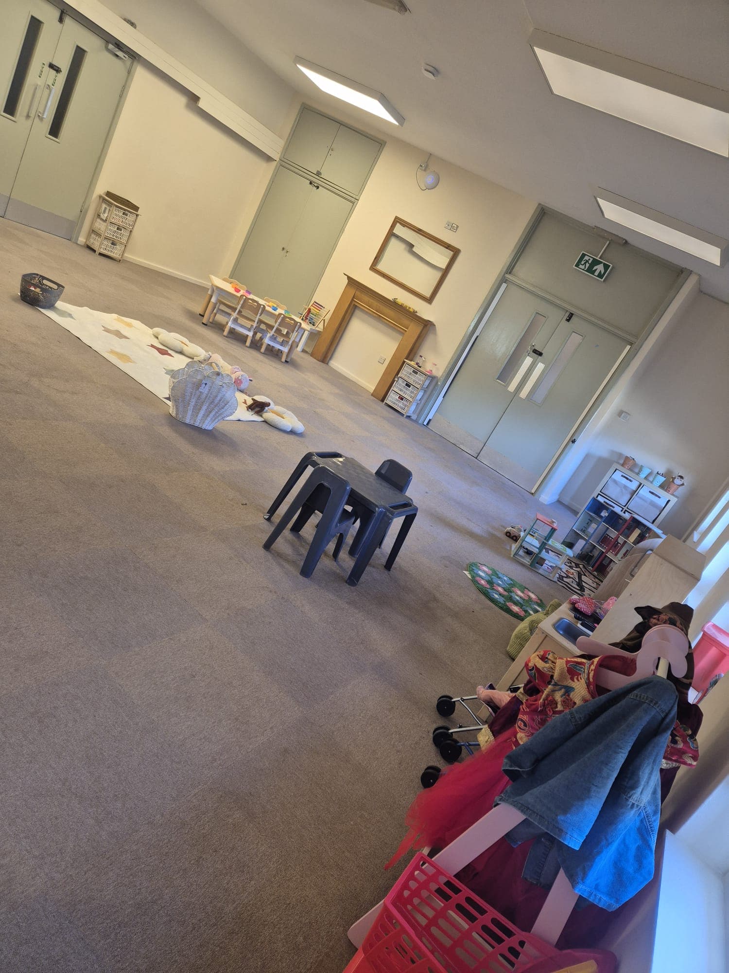 The main play room at Daisy Rose Daycare with space for play and creative activities.