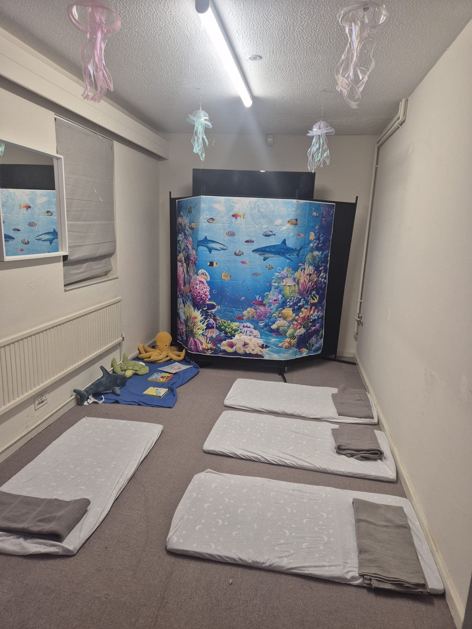 A calm rest and sleep area for little ones at Daisy Rose Daycare.